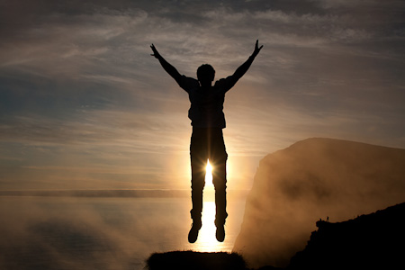 Man jumps into the air at Runde Island (Norway)